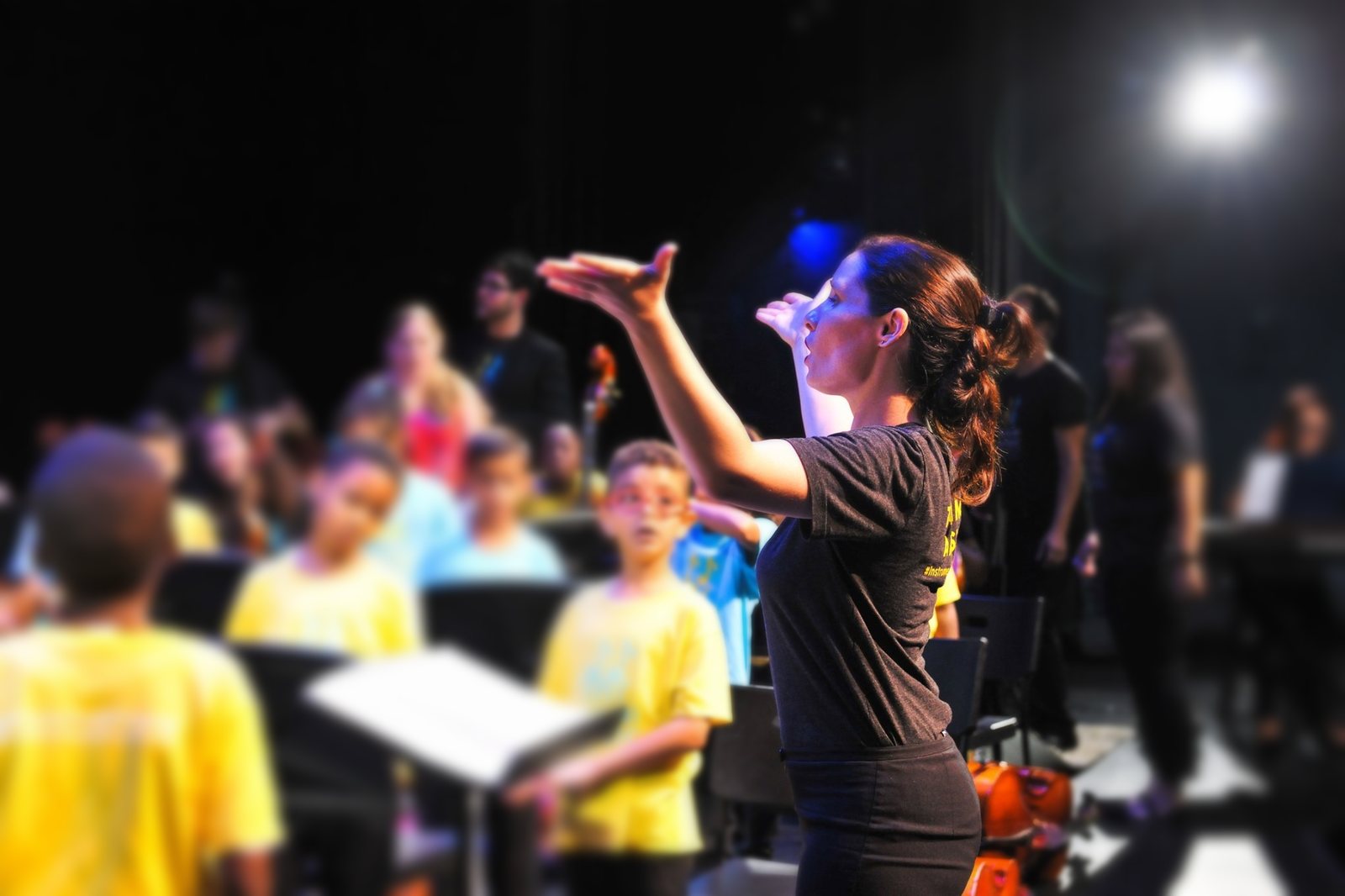 Mrs. Lambe-Estevez conducting a children's choir